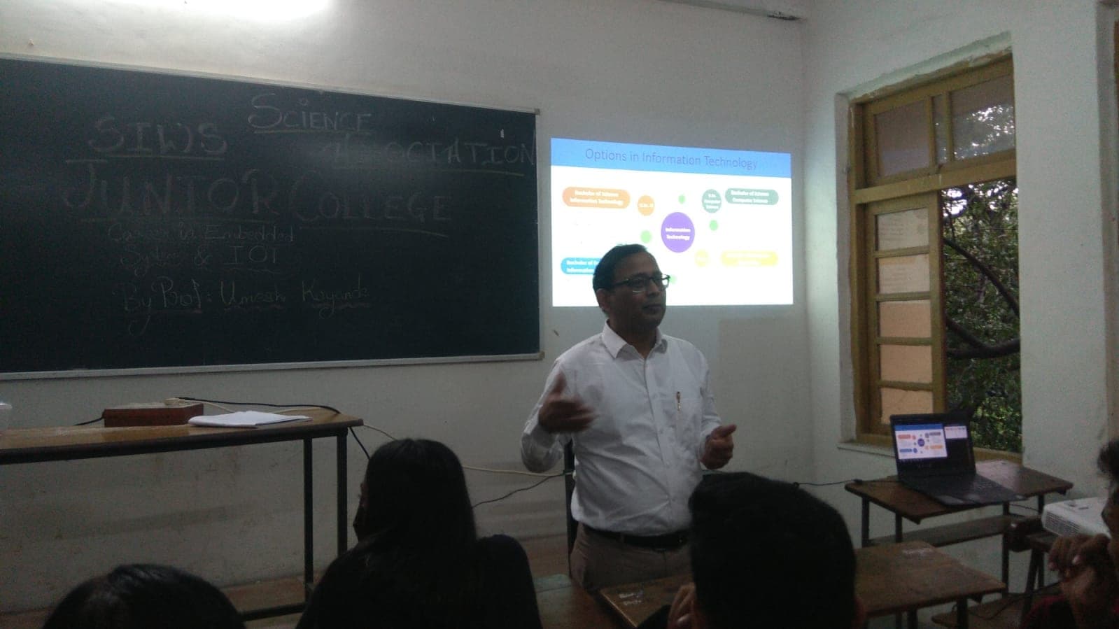 A career guidance session on Information Technology, students seated for the talk.
