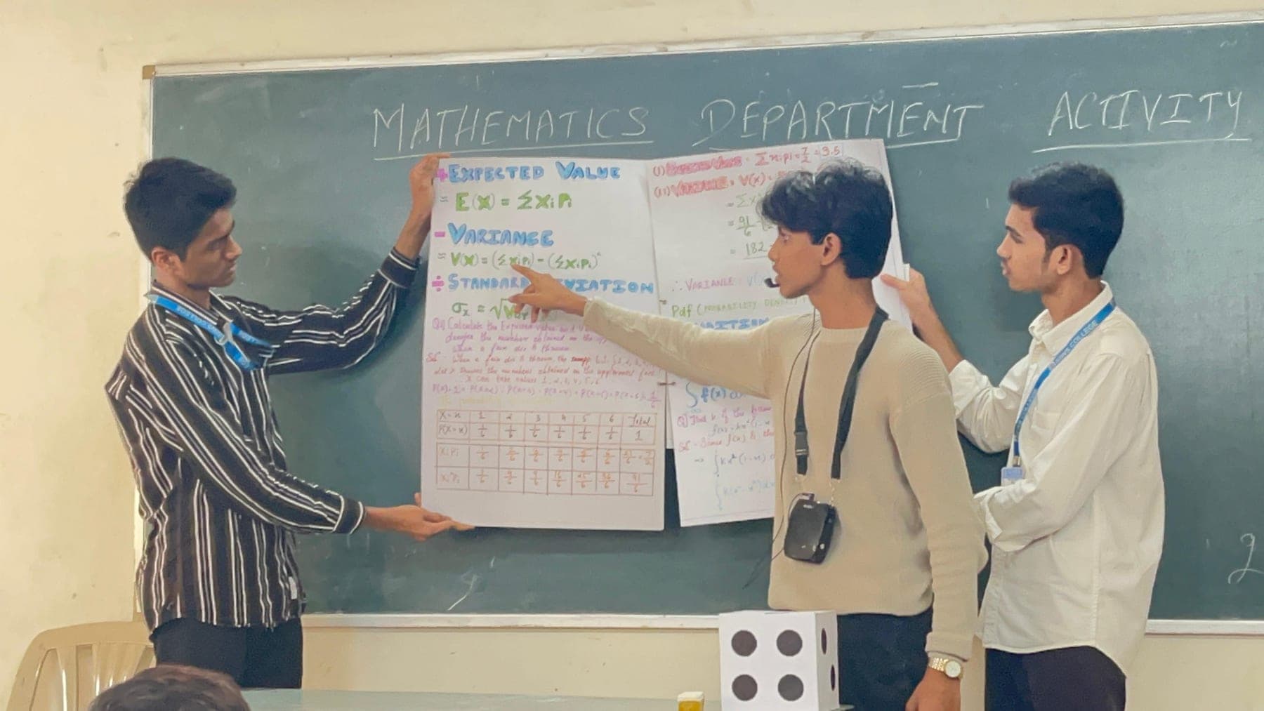 A Mathematics activity, students working through it together.