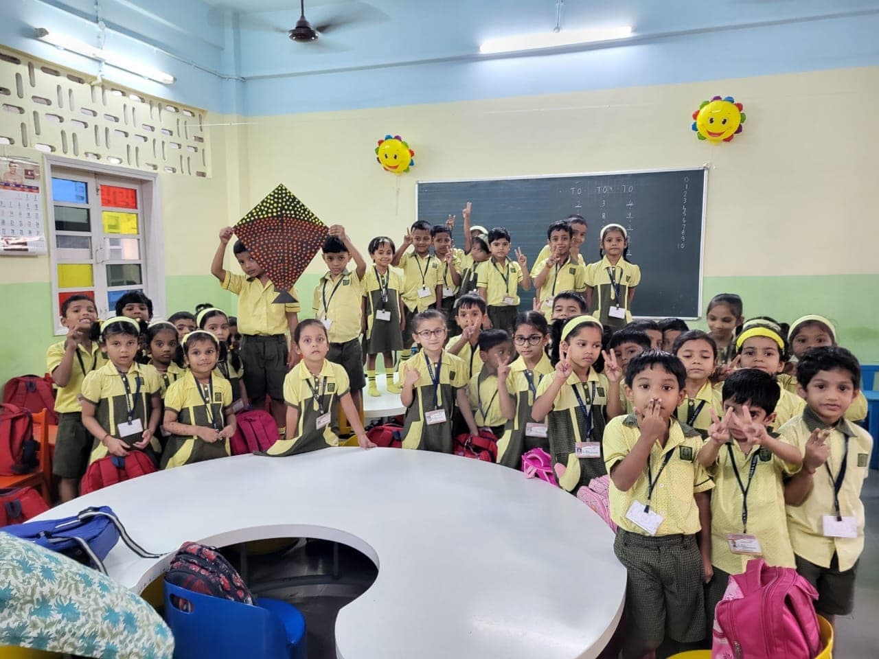 Kindergarten children performing on stage at a school programme.