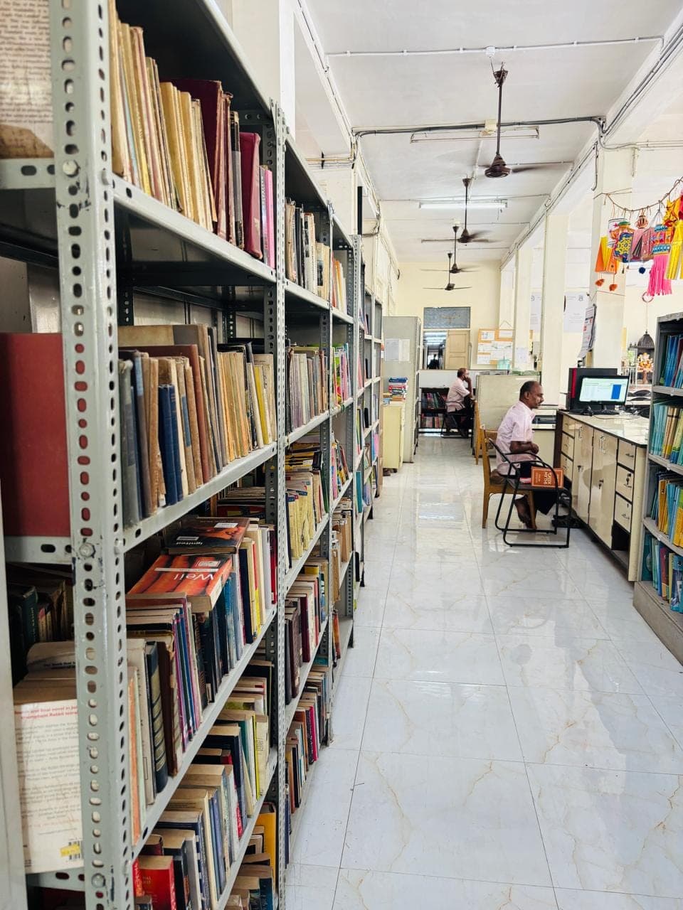The college library, its shelves stocked for the Commerce and Science streams.